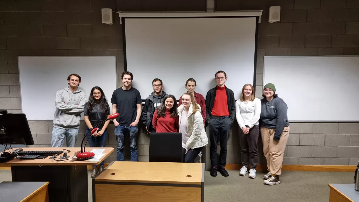 A group of students in a room with a guest speaker