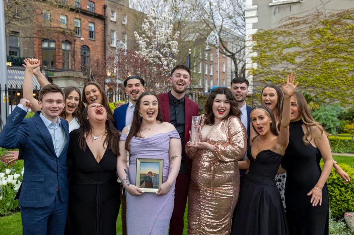 Members of the Limerick Voice, who were the winners of Newspaper of the Year, holding a picture of Joe Drennan