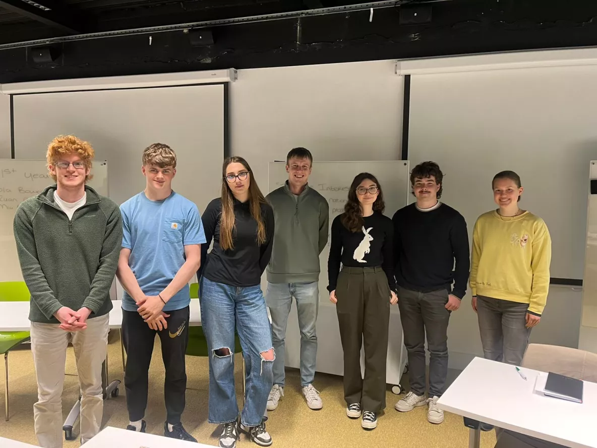 A group photo of the Sustainability Debate Teams (L to R - 1st year team: Ruan O' Dowd, Tola Bowen-MacCurtain, Mia Borko. Centre: Jack O' Connor, UL Student Sustainability Lead. 2nd year team: Rosie Kennelly, Eoghan O' Mahony, Tamar Orosz)