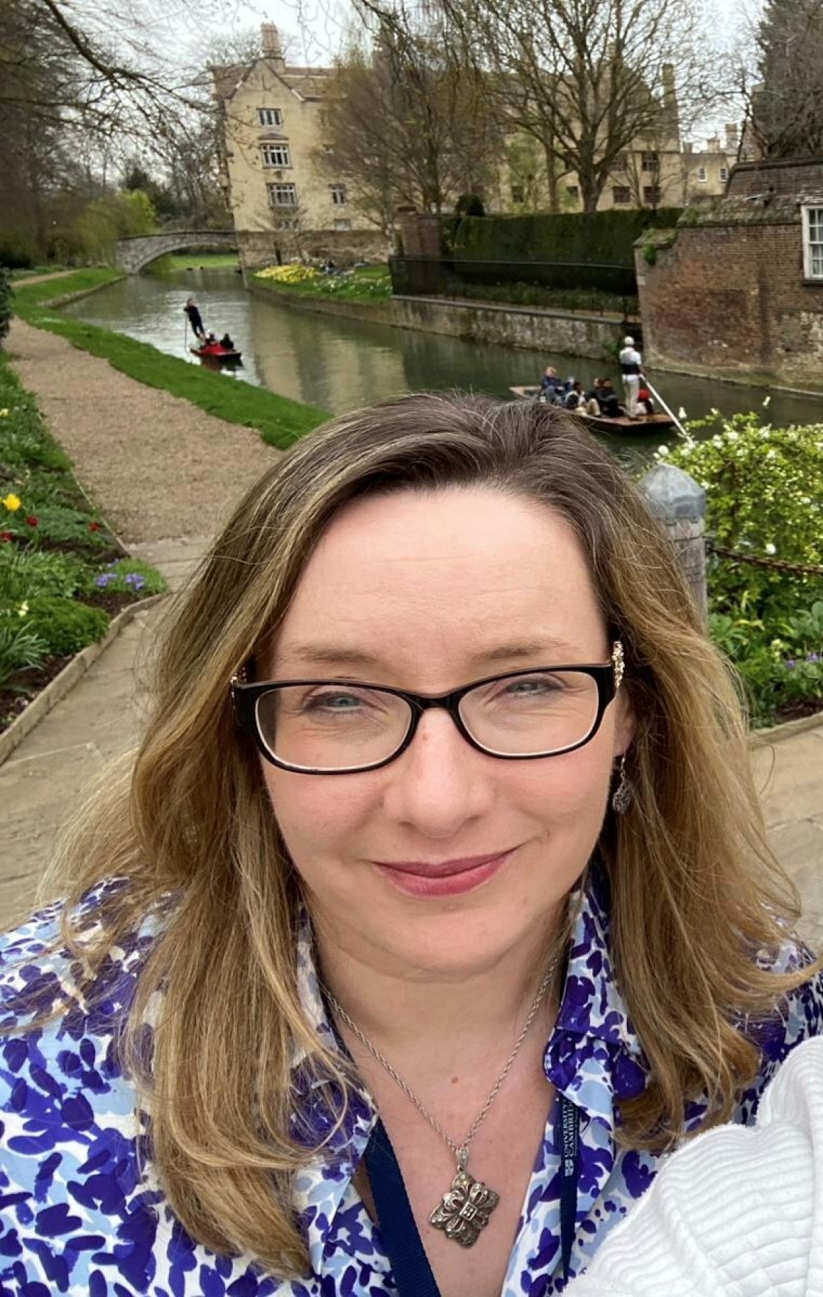 Dr Una Woods in front of the canal in Cambridge University.