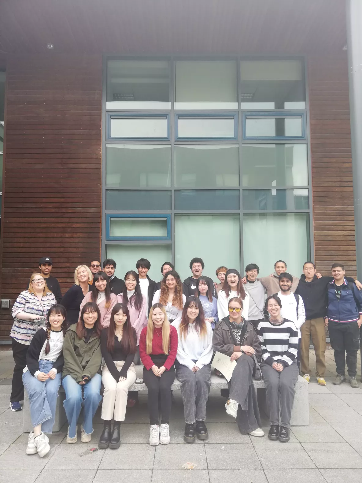 Class photo of preparation for university students with teachers