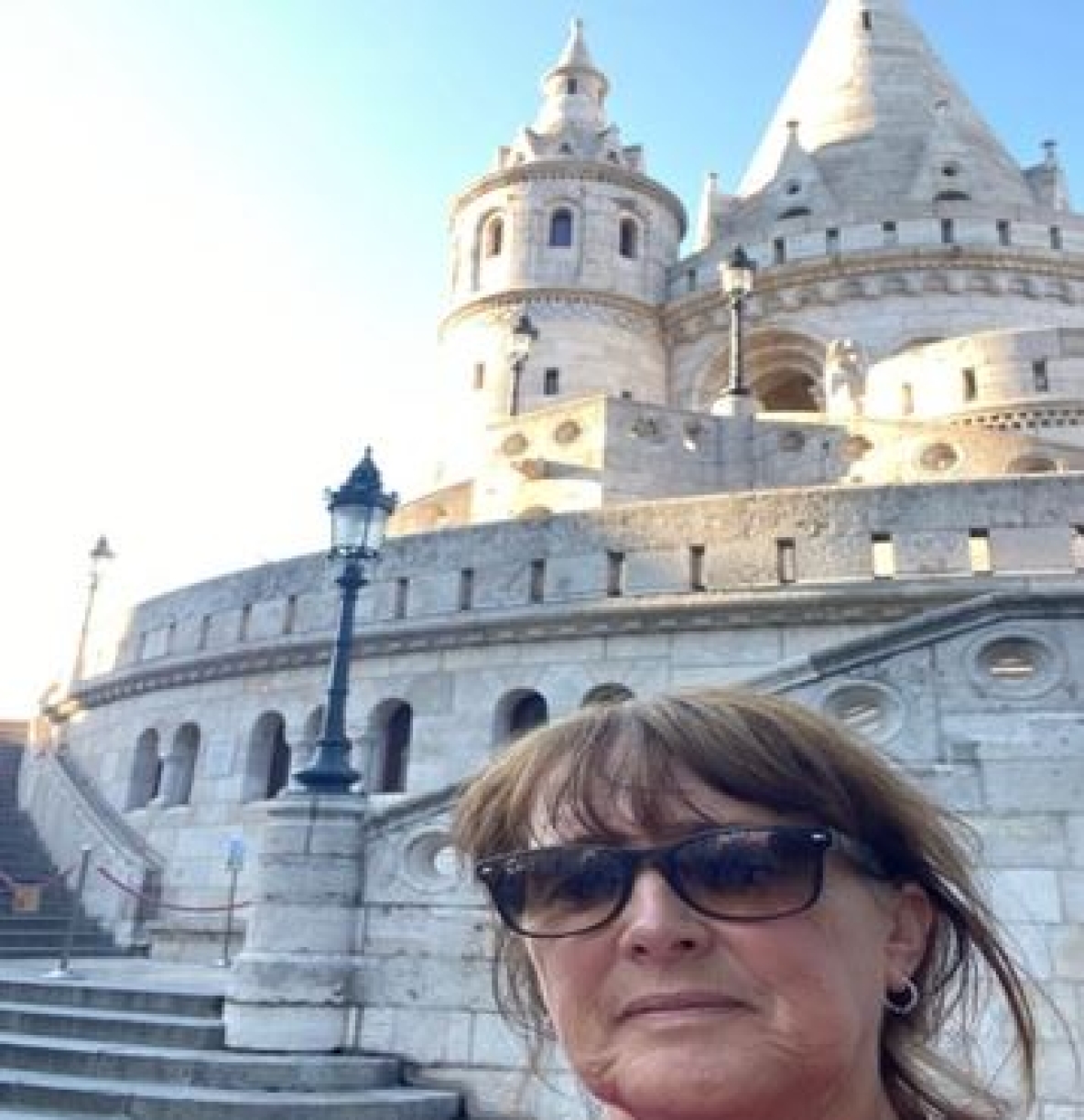 Dr Niamh Lenahan in front of a building in Budapest