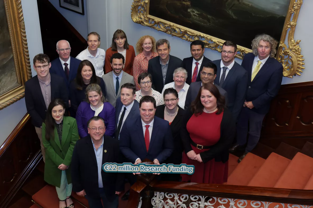 A group of people with the Minister announcing the funding