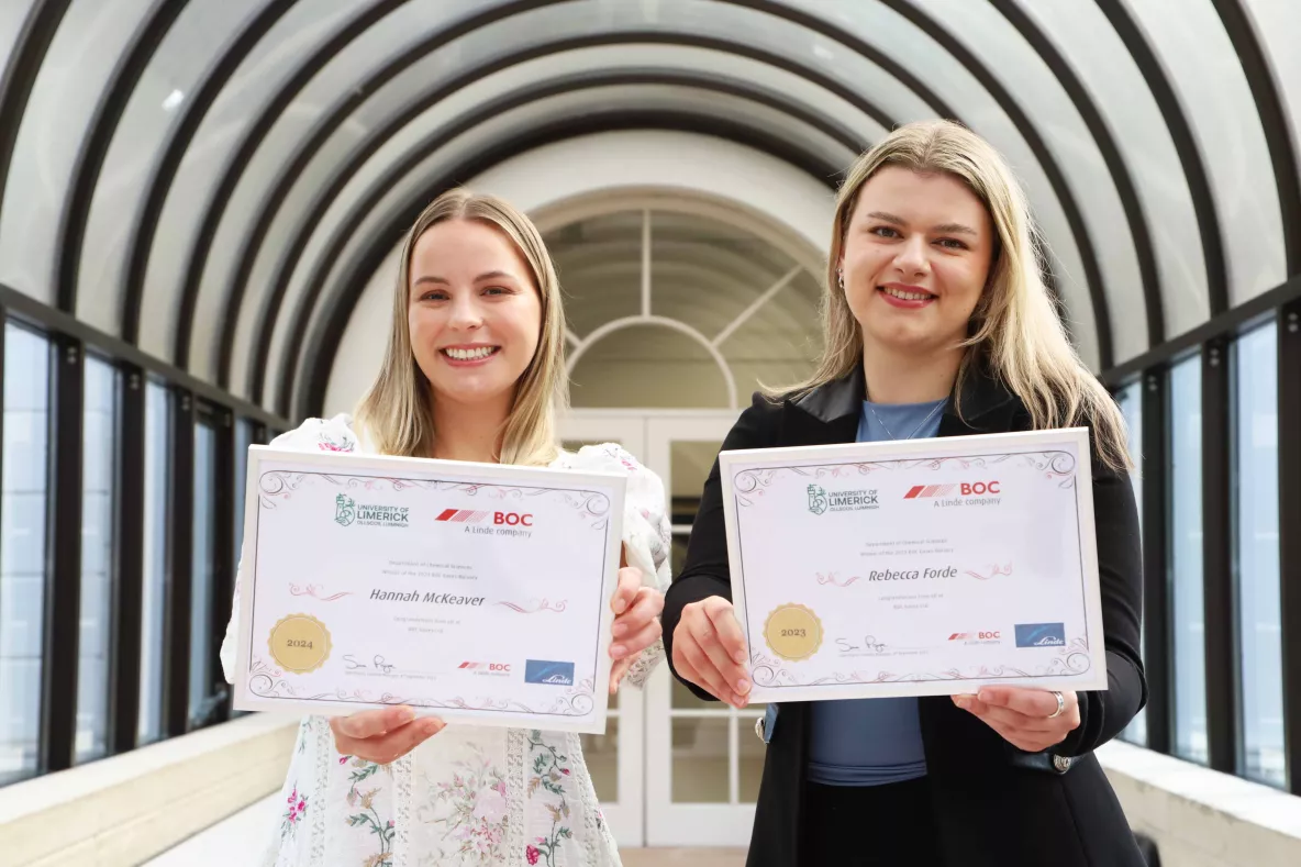 Hannah Mckeever and Rebecca Forde receive their BOC postgrad awards