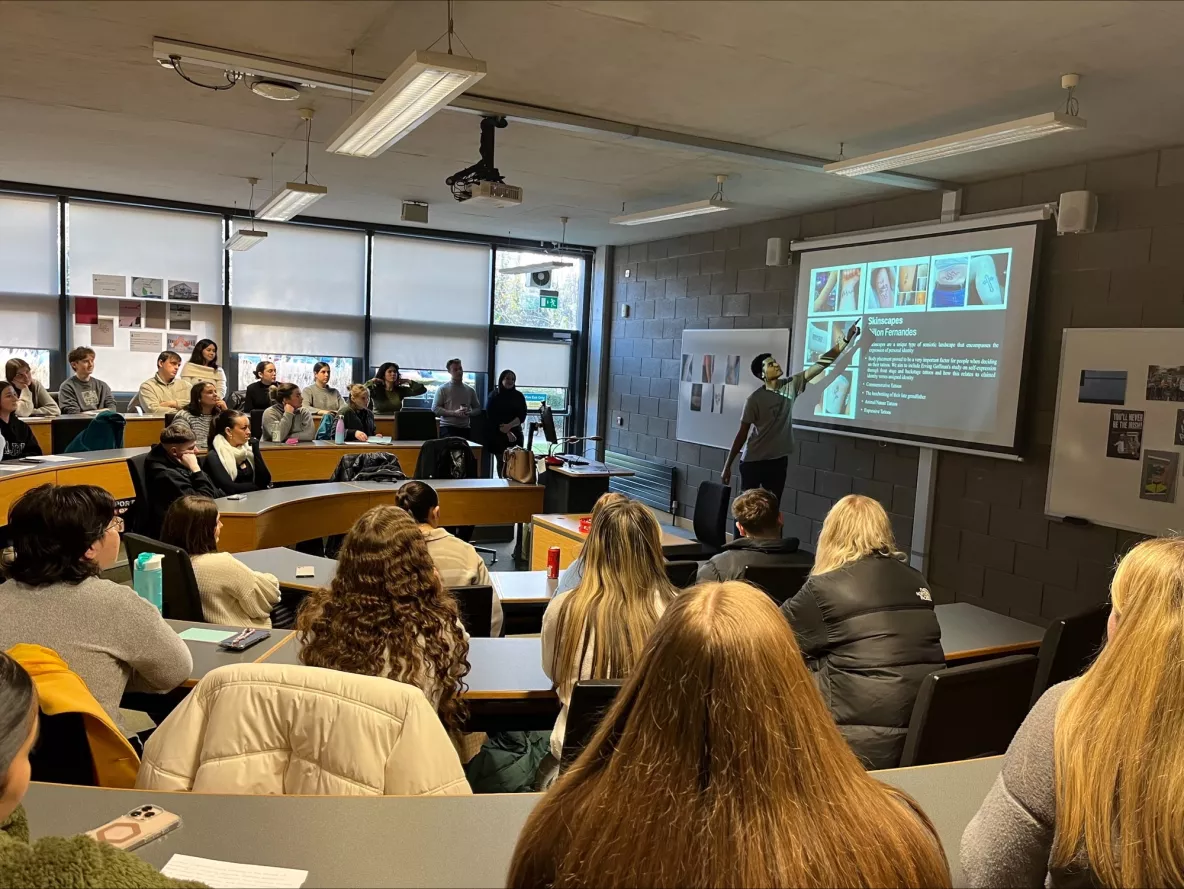 students listening to speaker at Linguistic Landscape Exhibition