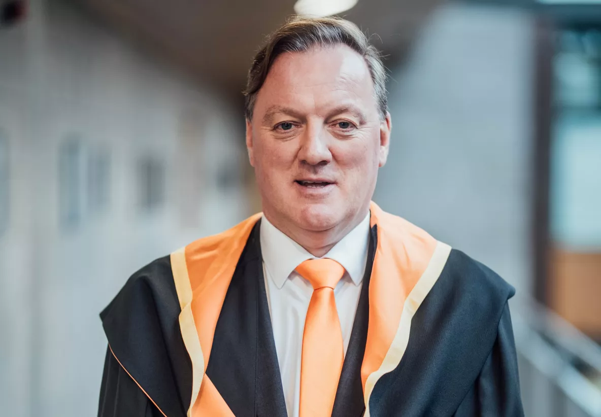 A picture of Paul Kelleher, Vice President of Engineering for QT Technologies Ireland Limited in his conferring robes