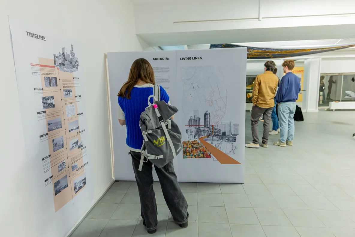 Woman at exhibition reading poster