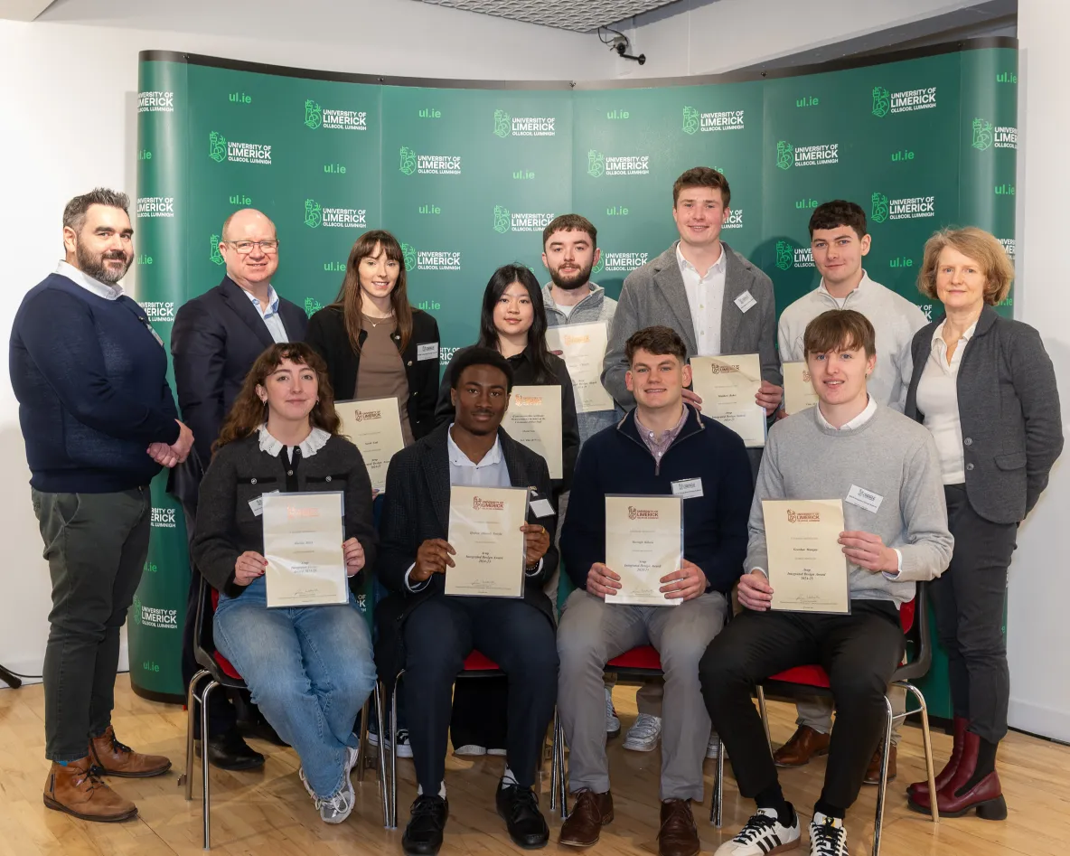 A picture of a large group of scholarship recipients at the award ceremony. They are each holding certificates