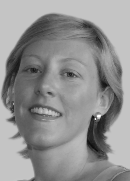Headshot image of Paula Corbett in back and grey