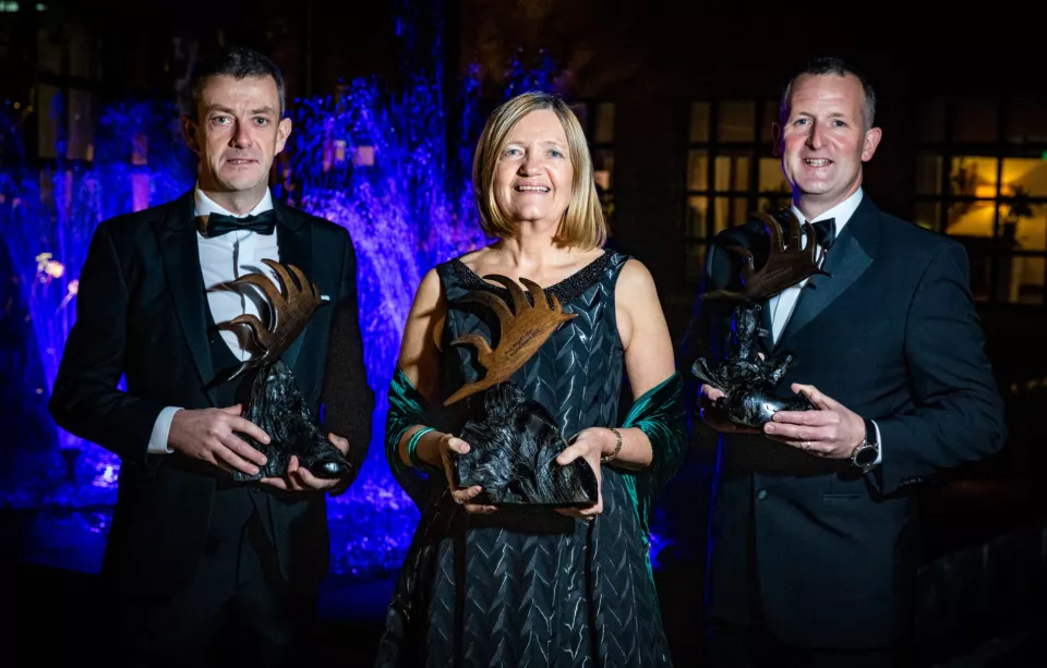 2018 Alumni Award Recipients holding their awards