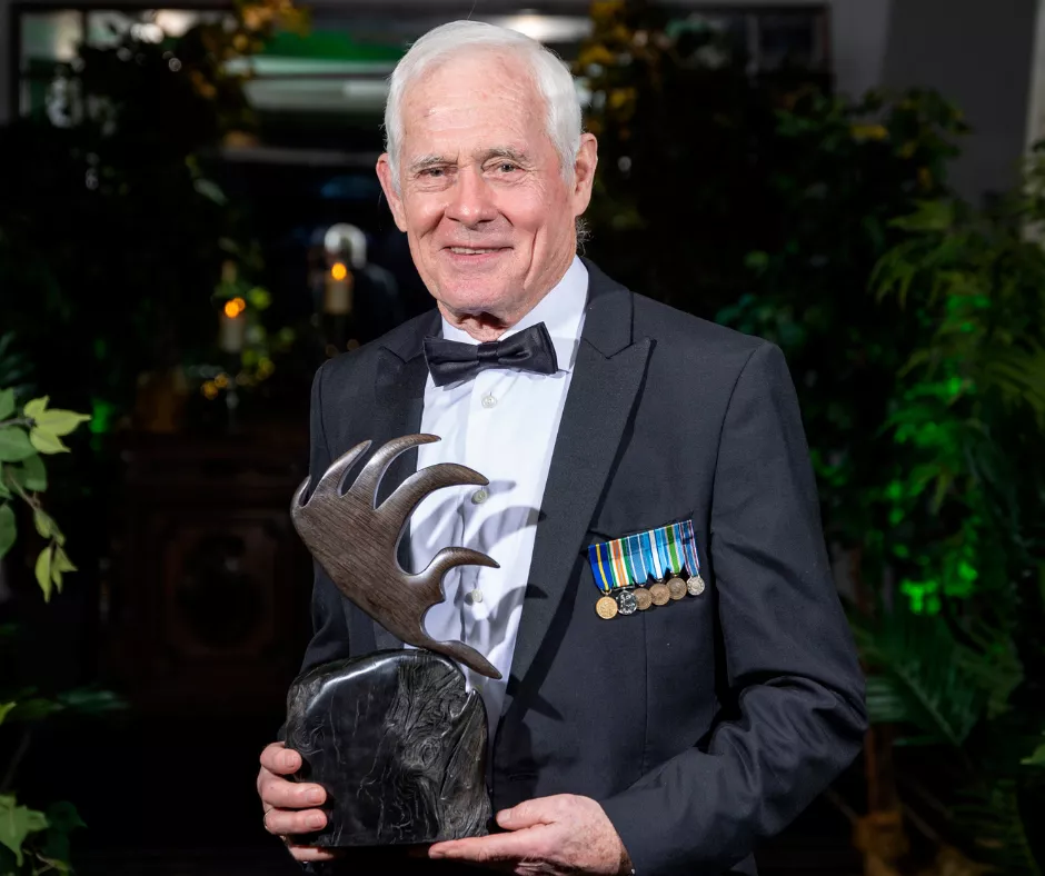 Col. Colm Doyle holding his UL Alumni Award