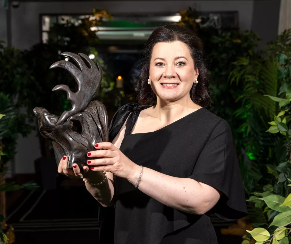 Ms Imelda Hurley holding her UL Alumni Award