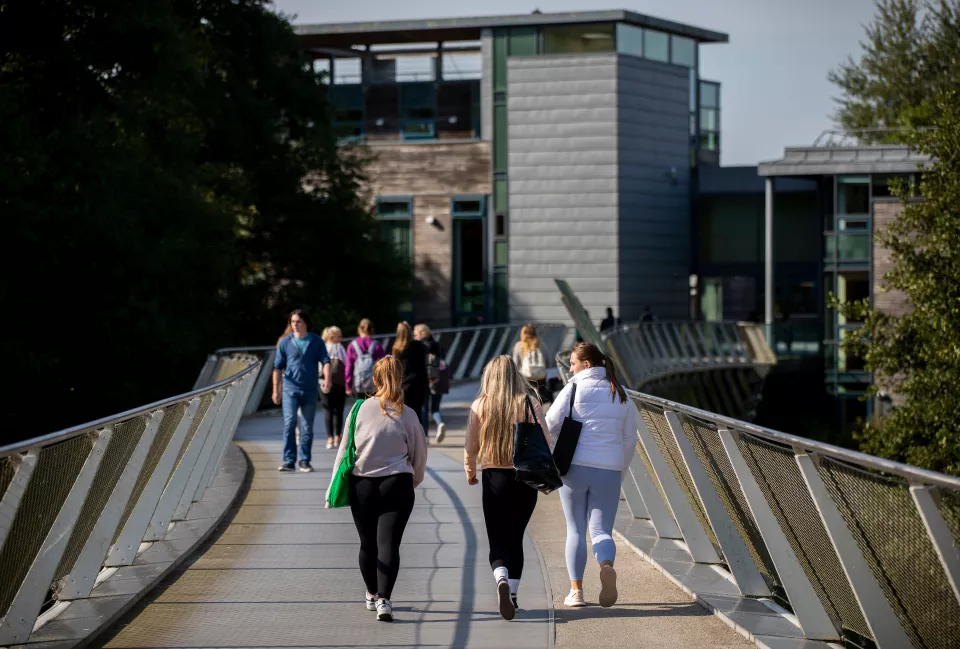 Clusters of students crossing the UL Living Bridge