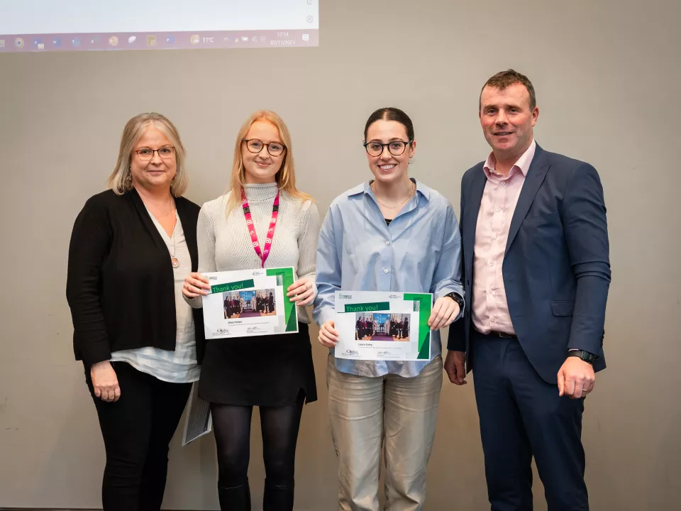 UL staff members being presented with certificates by Bobby O'Connor Human Resources and Teresa Leahy JAI