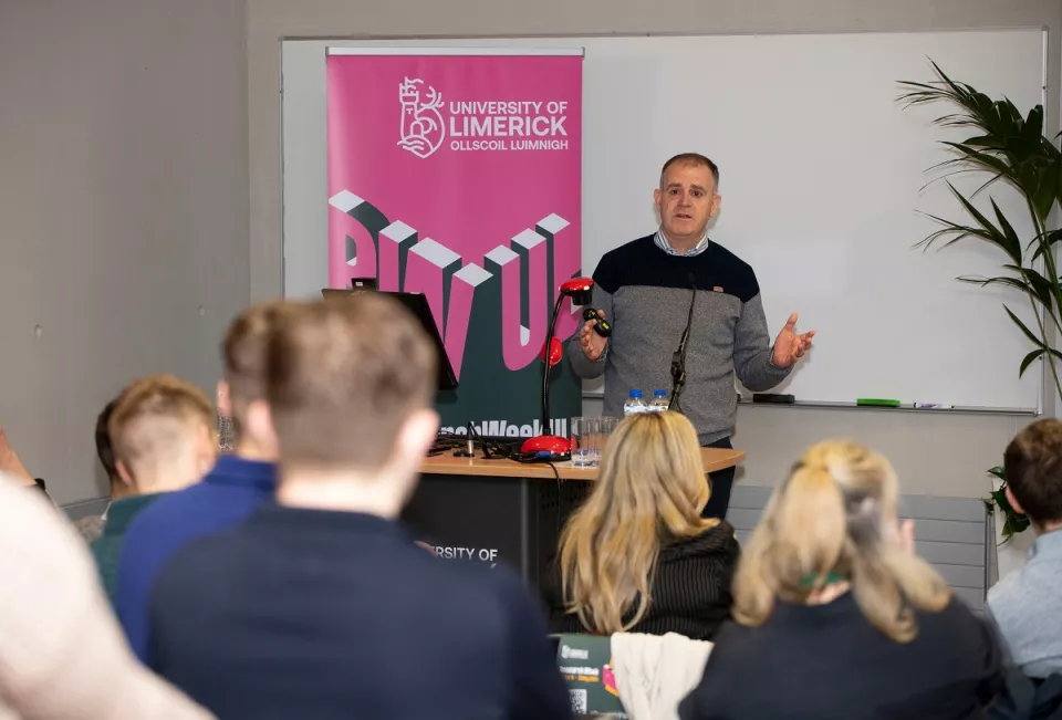 A man giving a talk as part of Research Week