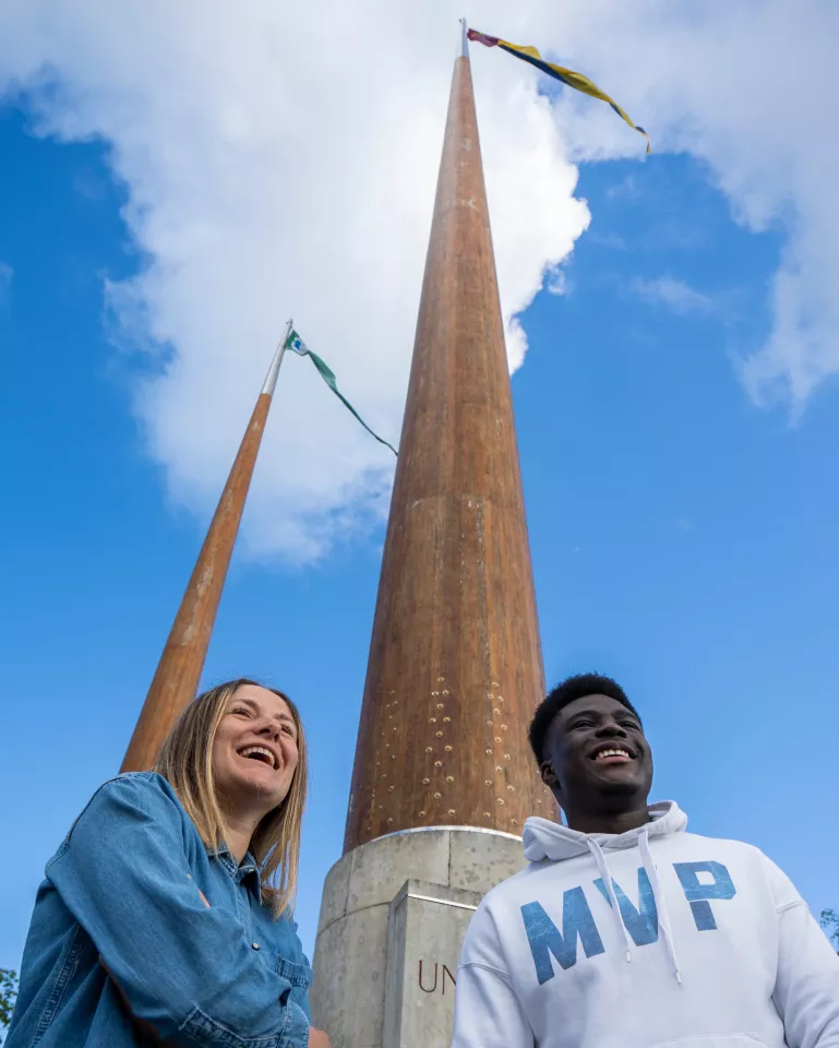 Students at UL flagpoles