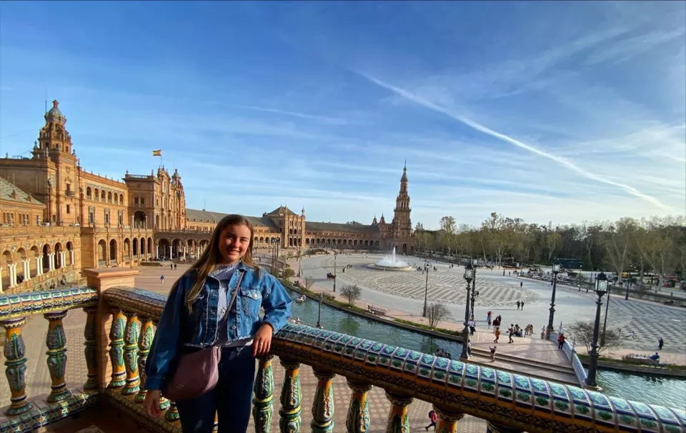 Person standing in front of fountain