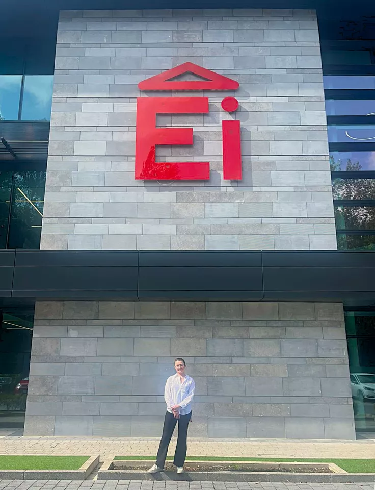 girl standing in front of building