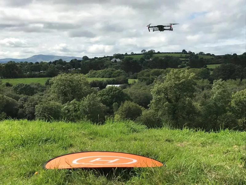 Drone flying in a field